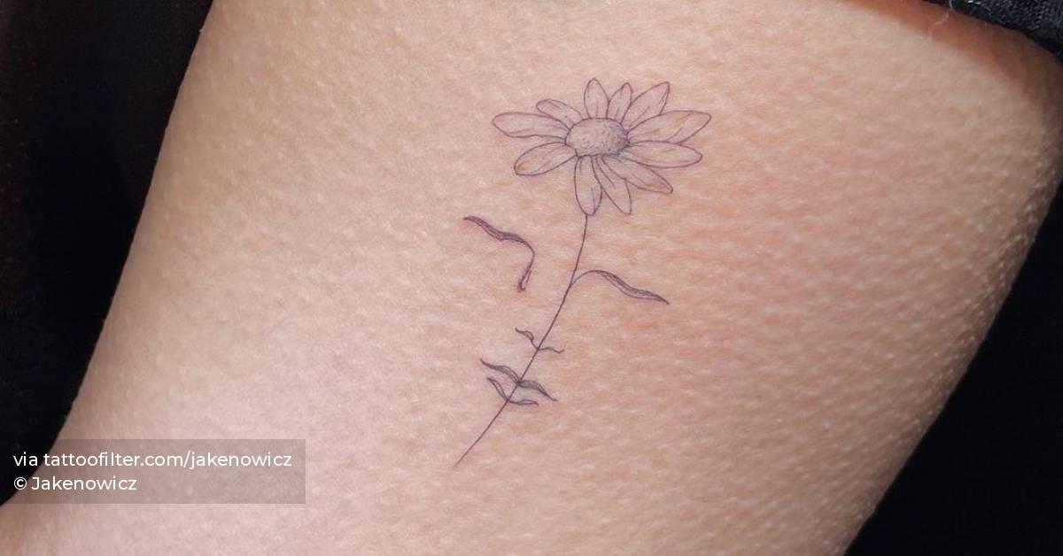 Single needle flower head woman tattoo on the inner