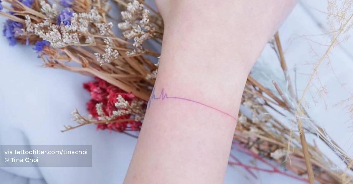 Minimalist heartbeat wristband tattoo.