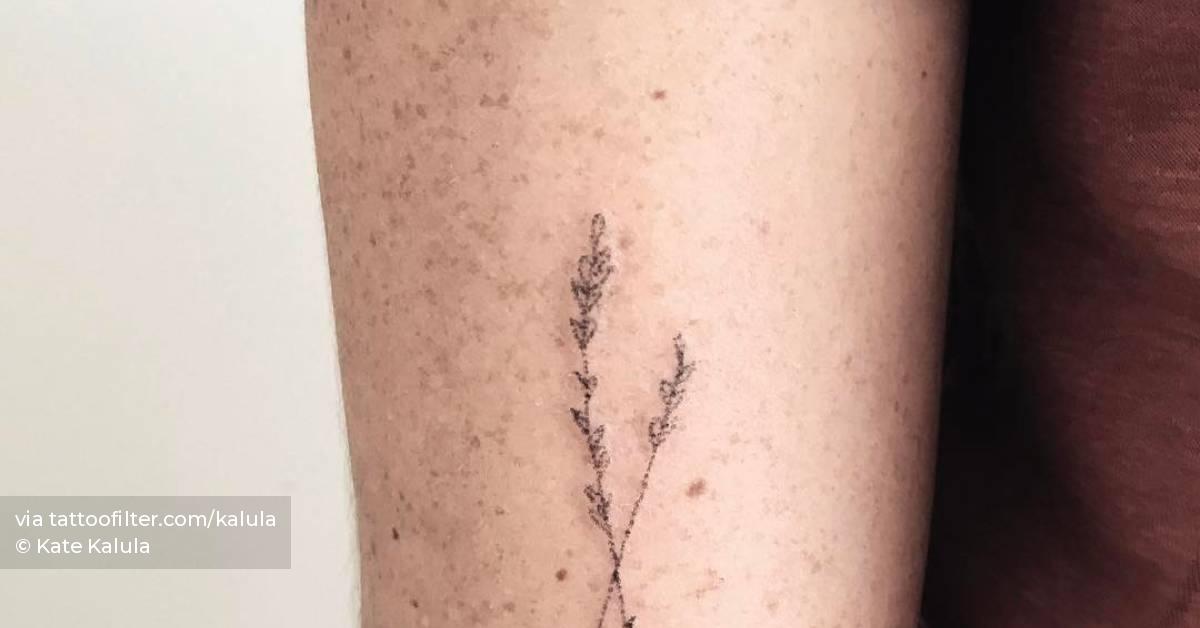Hand poked flower tattoo on the tricep.
