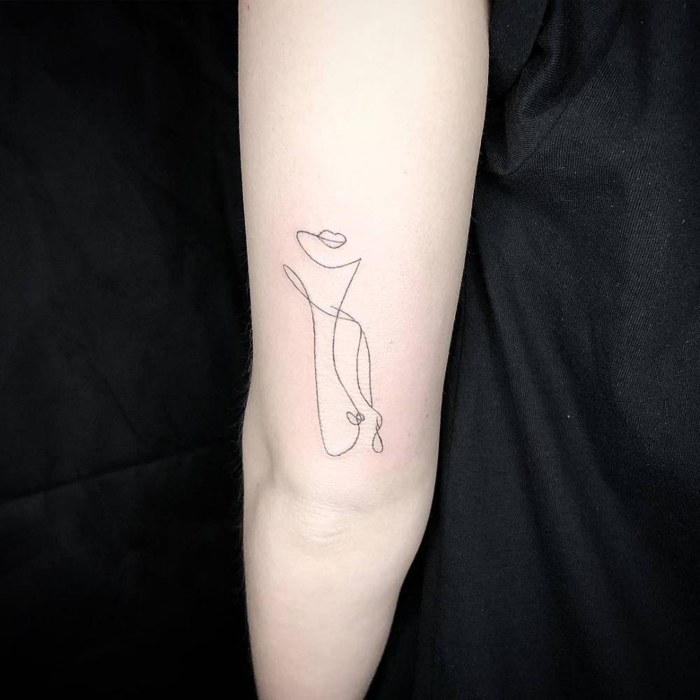 Single Line Nude Woman Tattoo On The Tricep Single Line Nude Woman Tattoo On The Tricep