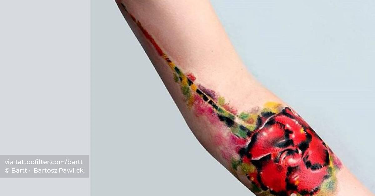 Abstract flower tattoo on the arm.