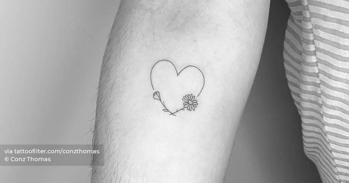 Minimalist heart and flowers tattoo on the inner