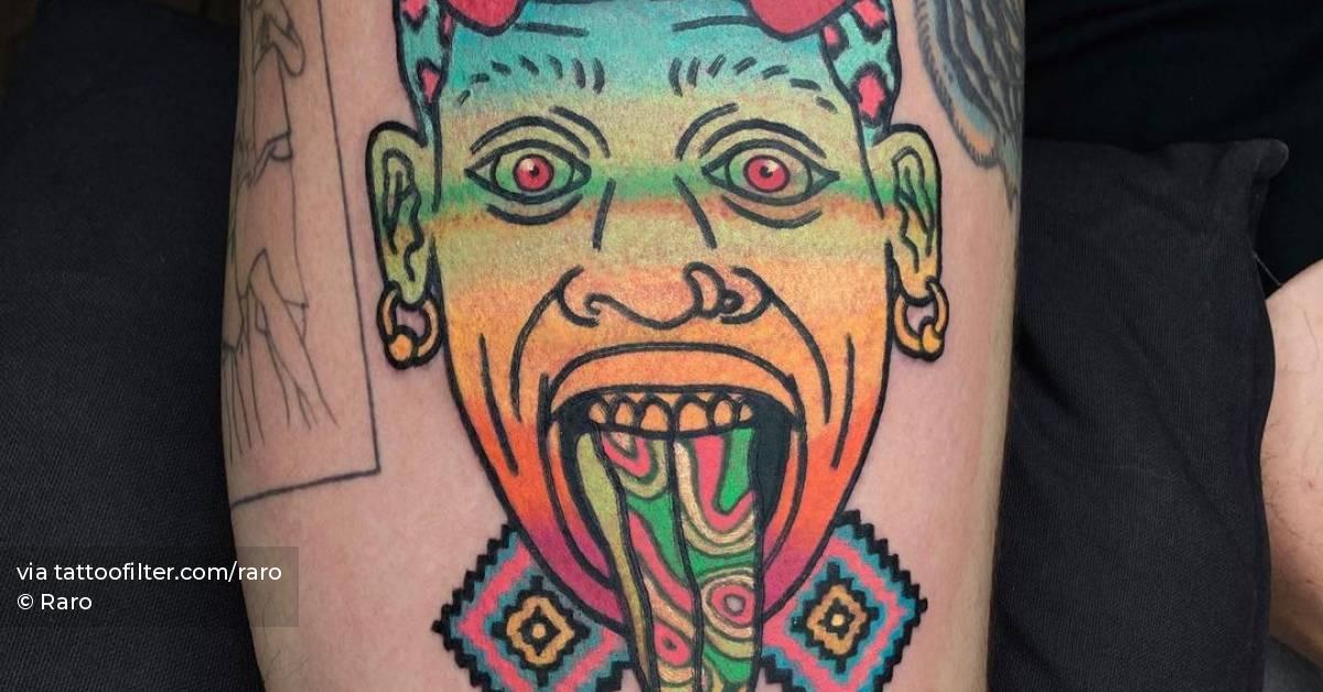 Dennis Rodman portrait tattoo on the upper arm.
