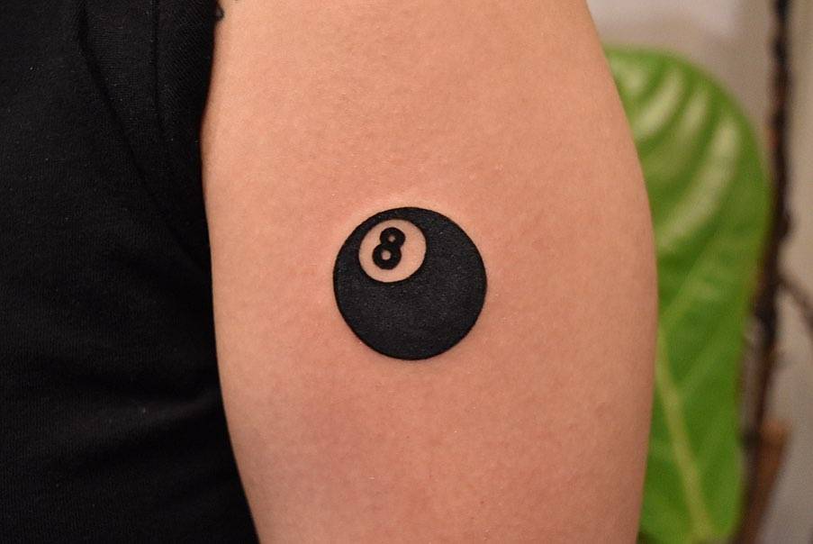Minimalist Eight ball Tattoo On The Upper Arm 