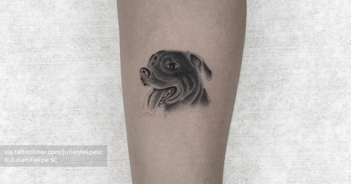 Micro-realistic dog portrait tattoo on the inner