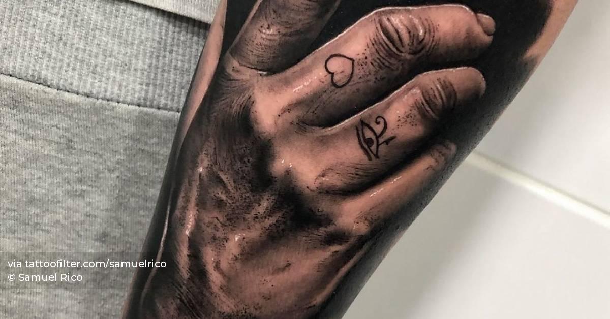 Black and grey hand tattoo on the inner forearm Black and grey hand