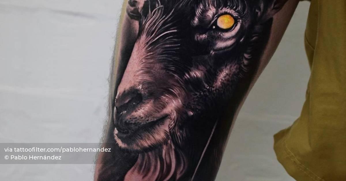 Realistic goat portrait tattoo on the thigh.