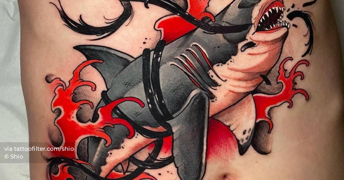 Neotraditional shark tattoo on the stomach.