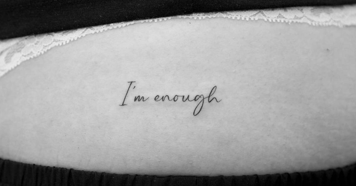 i-m-enough-lettering-tattoo-on-the-hip