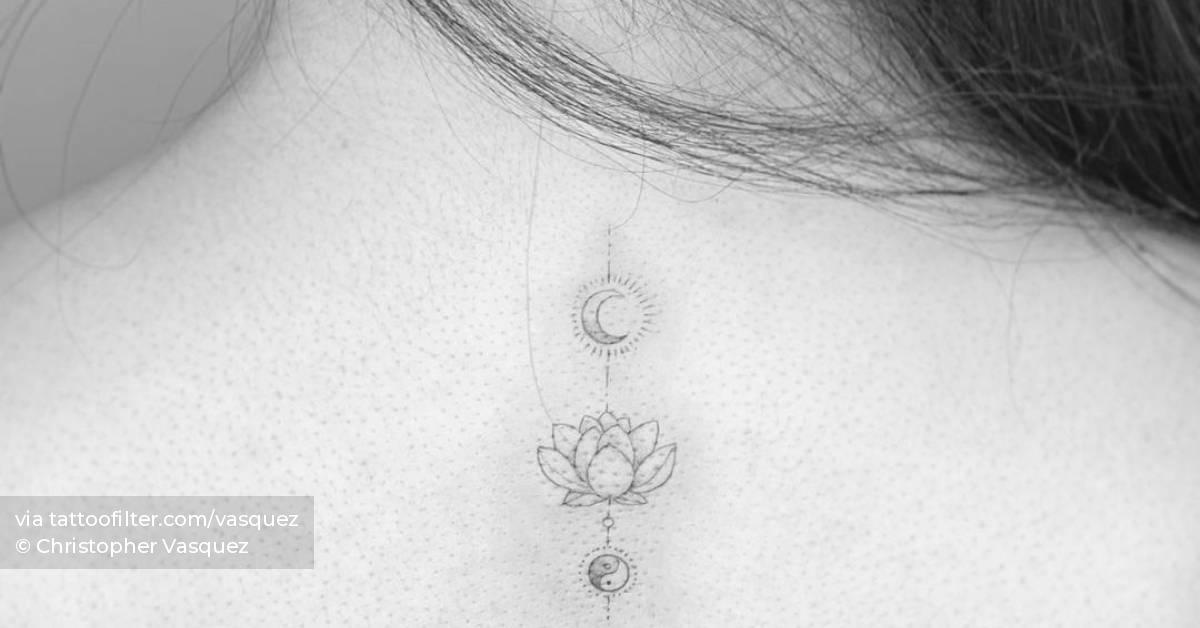 Fine line lotus flower, moon and Yin Yang tattoo on the