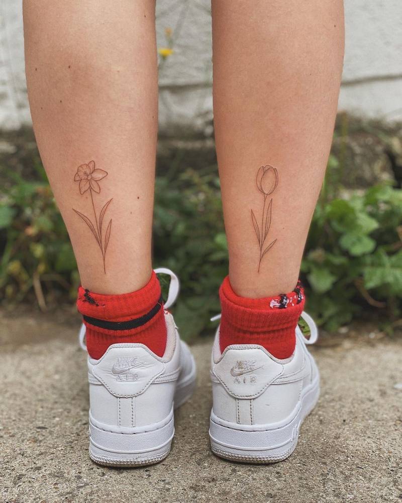Individual Matching Daffodil And Tulip Tattoos 