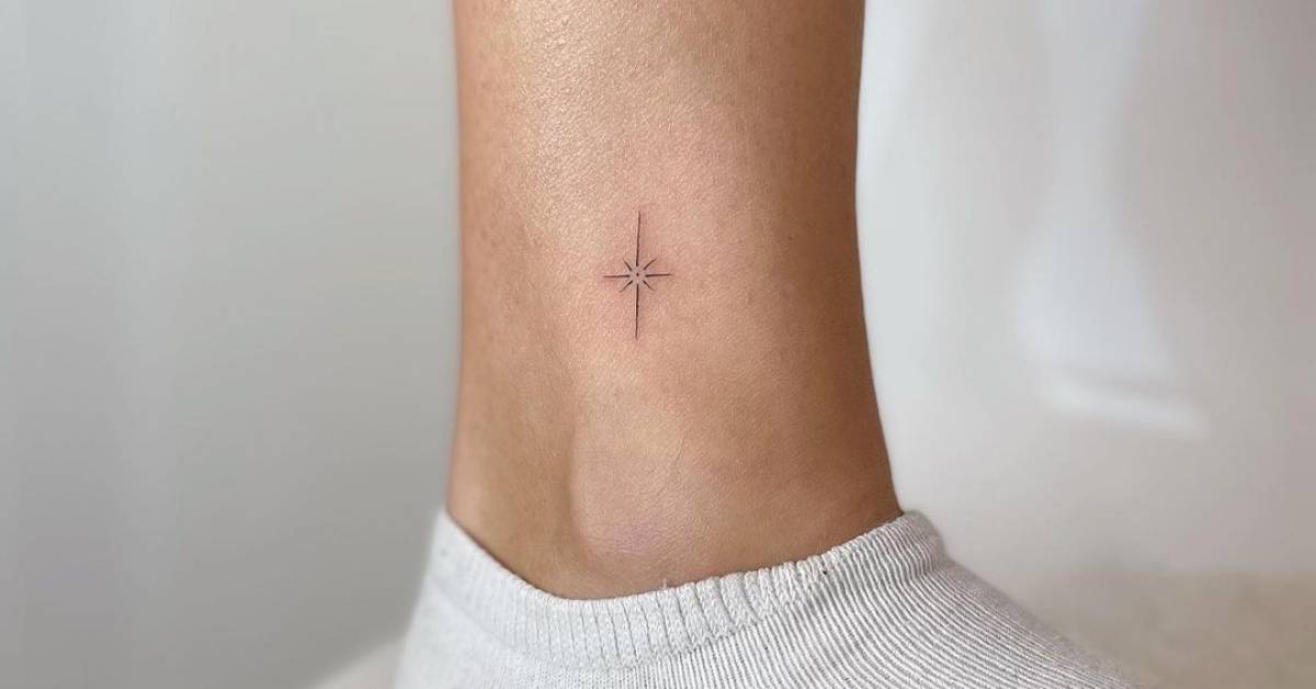 Ankle tattoo of the north star in fine line.