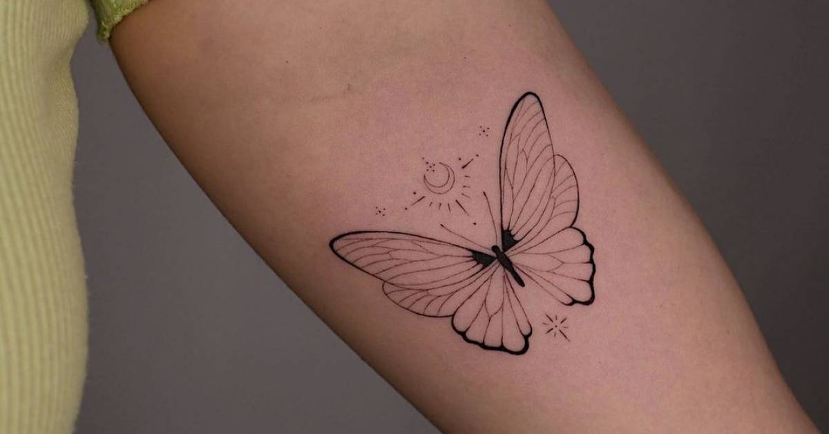 Tattoo of a butterfly, located on the inner arm, done