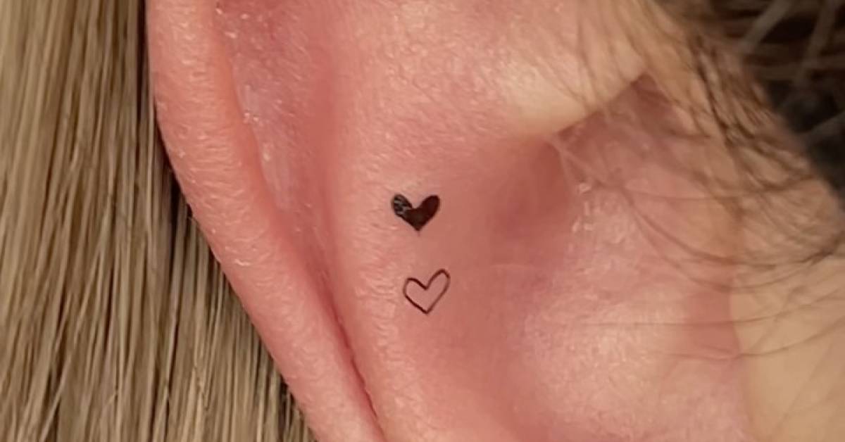 Tiny hearts tattoo located on the ear, minimalistic