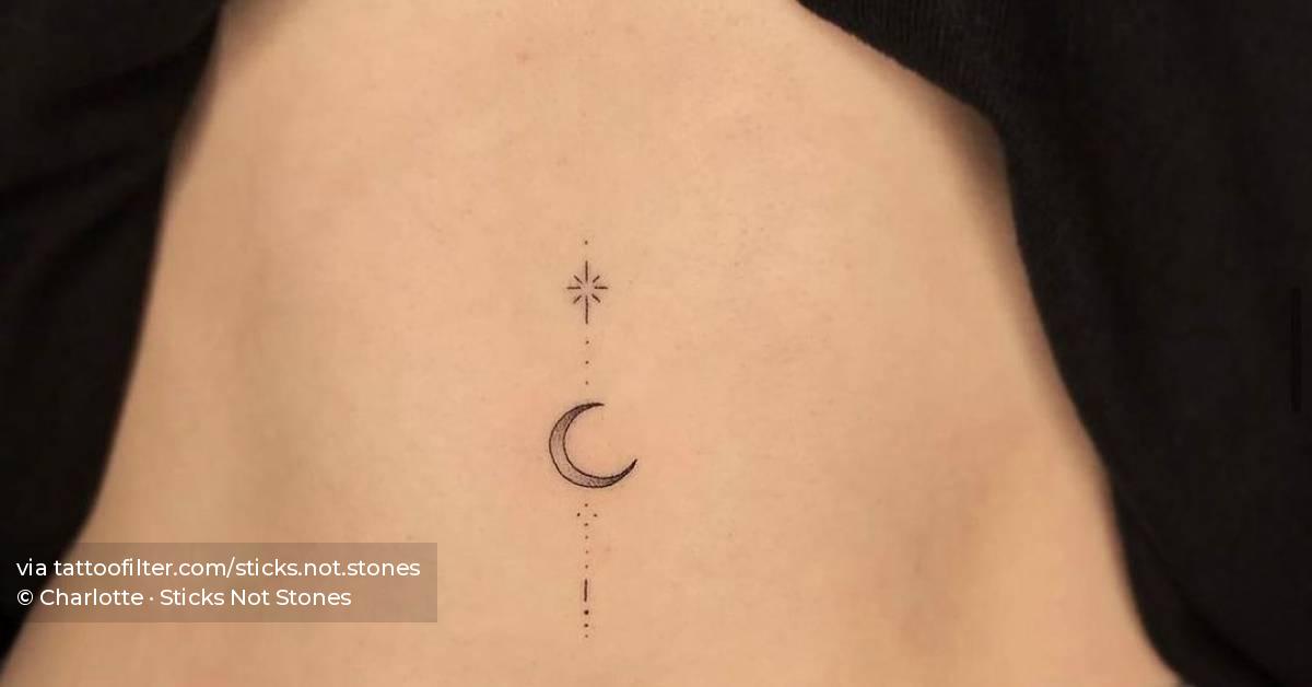 Ornamental moon and star tattoo hand poked on the