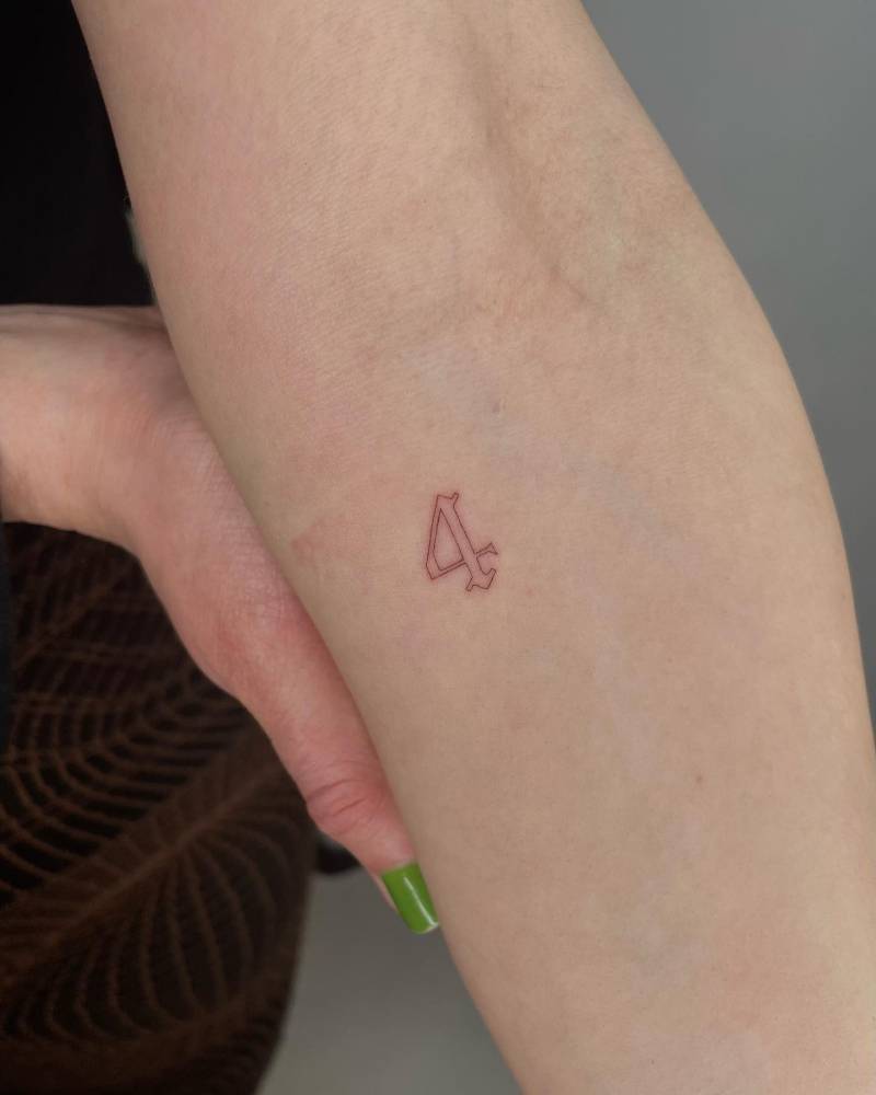 Tattoo Of The Number 4 Located On The Inner Forearm 