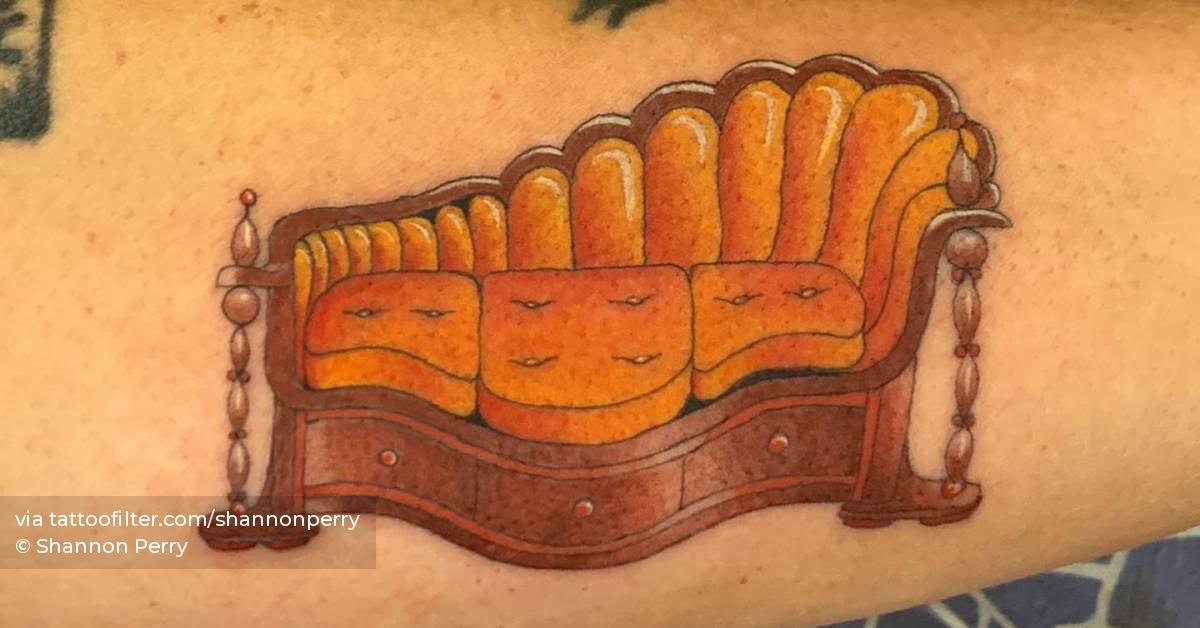Couch tattoo located on the forearm.