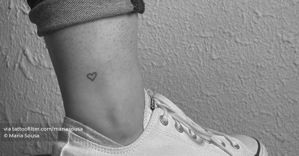 Minimalistic heart tattoo located on the ankle.