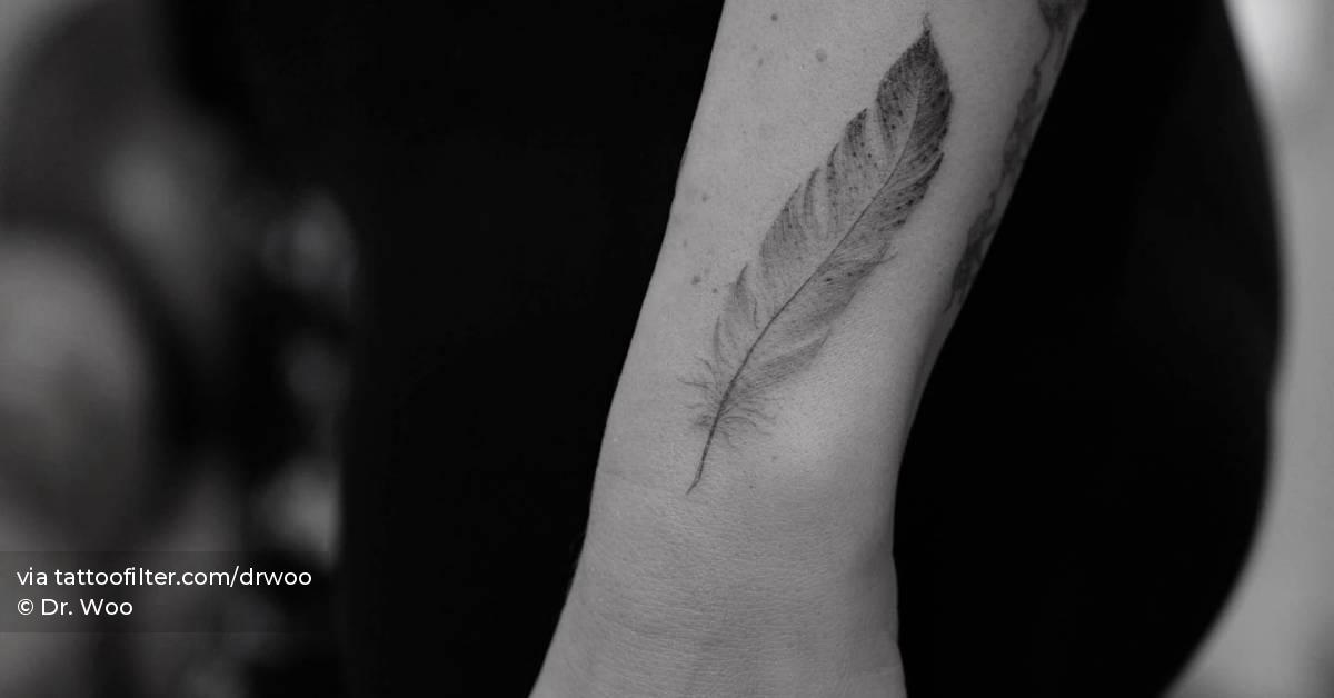 Single needle feather tattoo placed on the wrist.