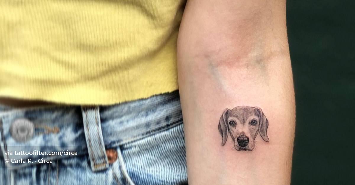 Micro-realistic dog portrait tattoo located on the