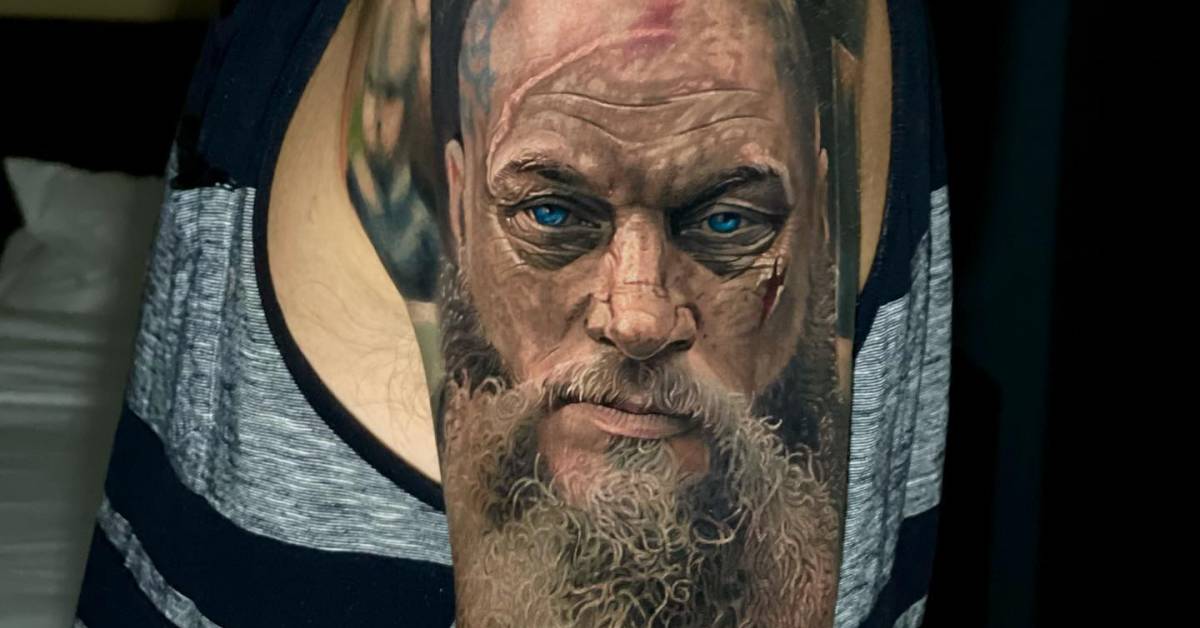 Ragnar portrait tattoo done on the upper arm.
