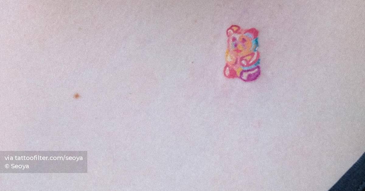 Gummy bear tattoo located on the chest.