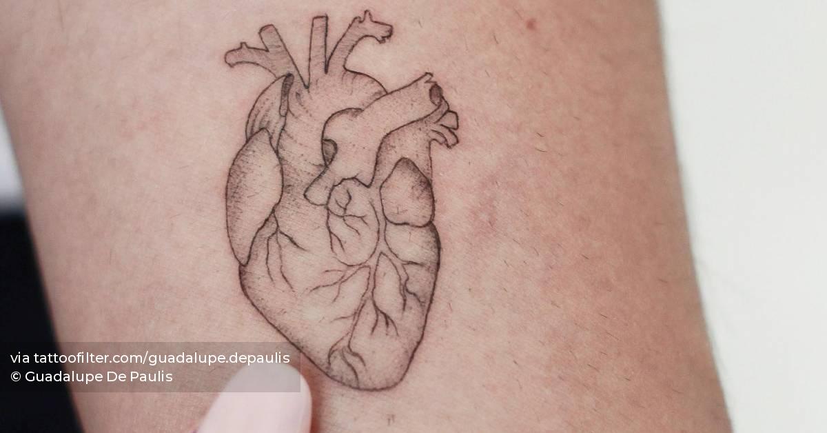 Fine line anatomical heart tattoo located on the wrist.