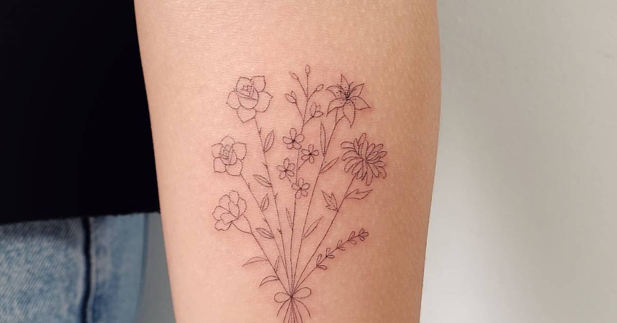 Flower bouquet tattoo located on the inner forearm,