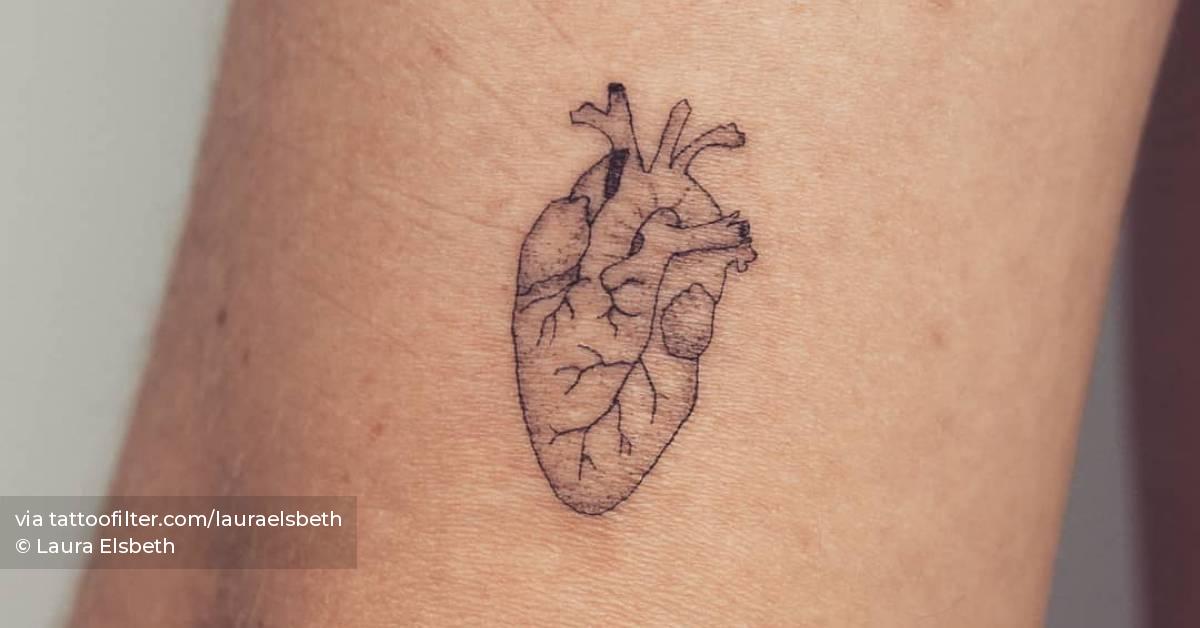 Fine line anatomical heart tattoo located on the