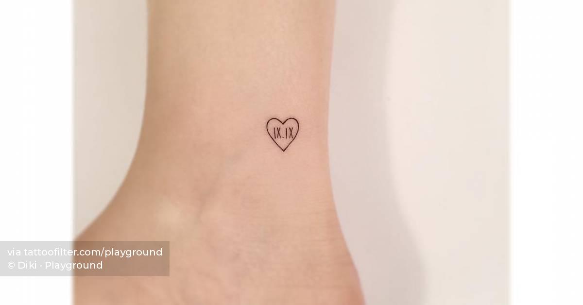 Tiny heart and roman numerals tattoo done on the ankle.