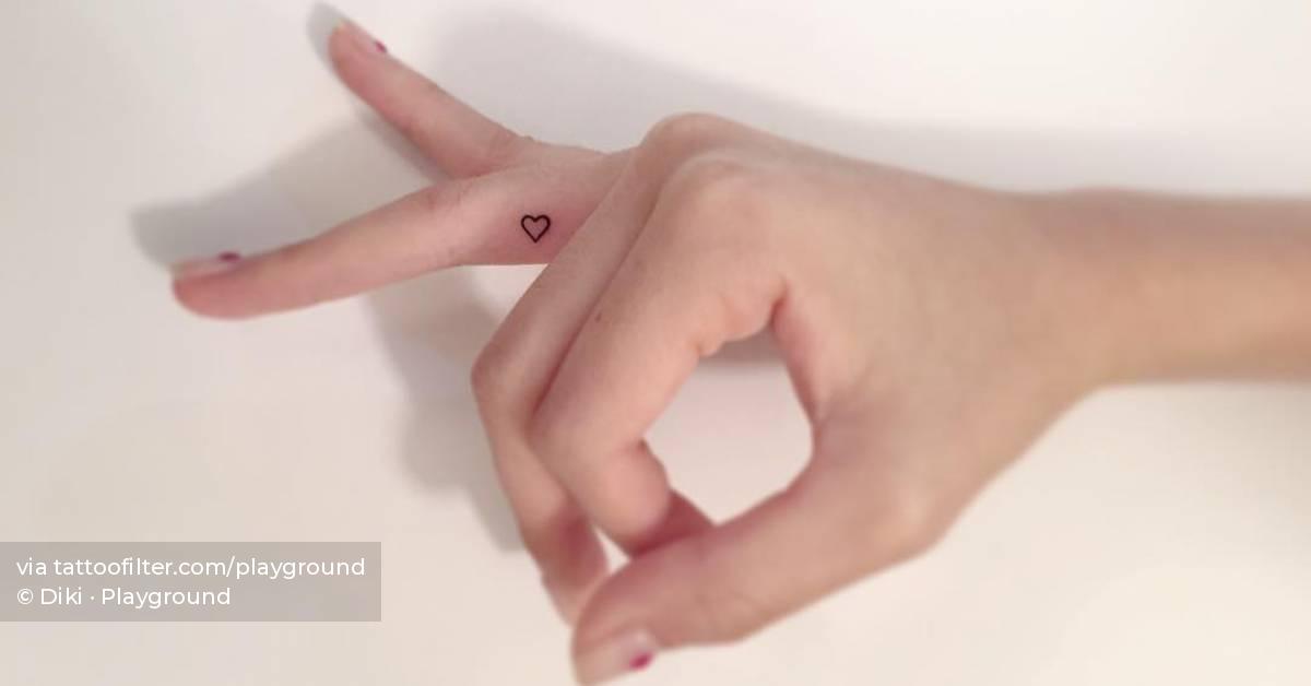 Tiny heart tattoo done on the finger.