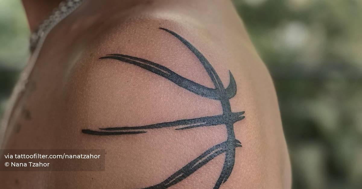 Basketball ball tattooed on the shoulder.