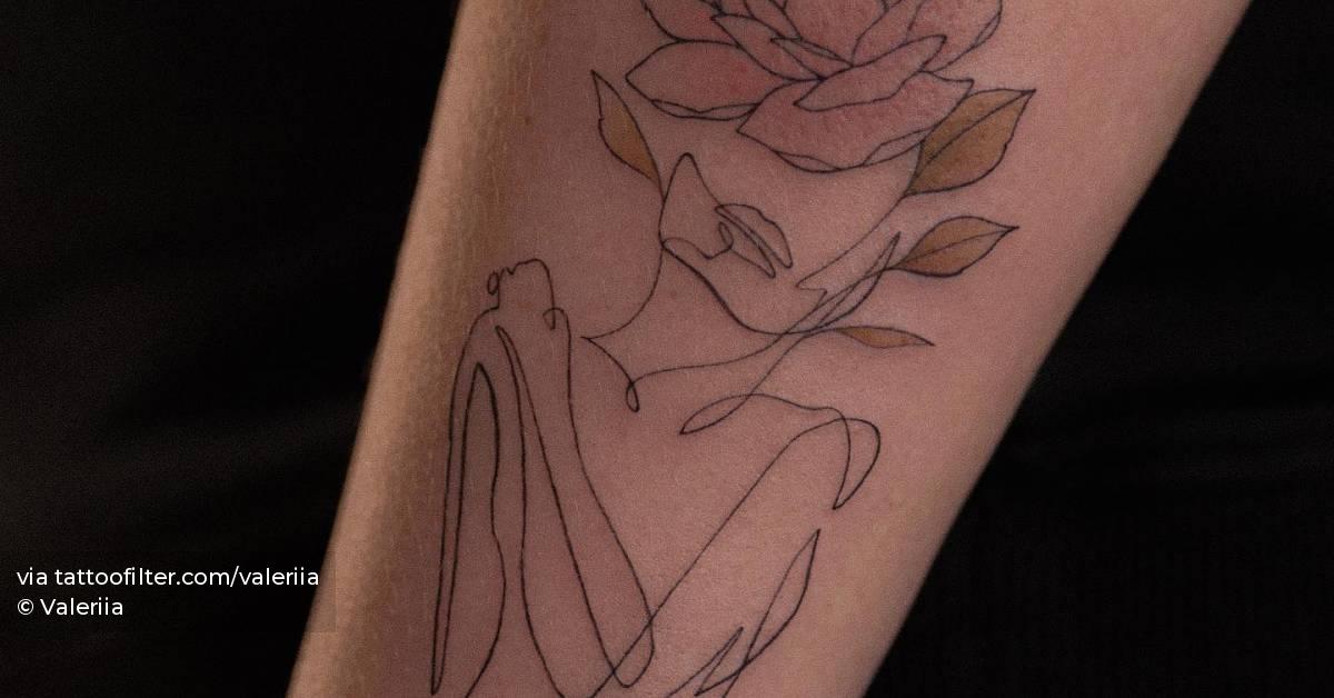 Fine line flower head woman tattoo done on the wrist.