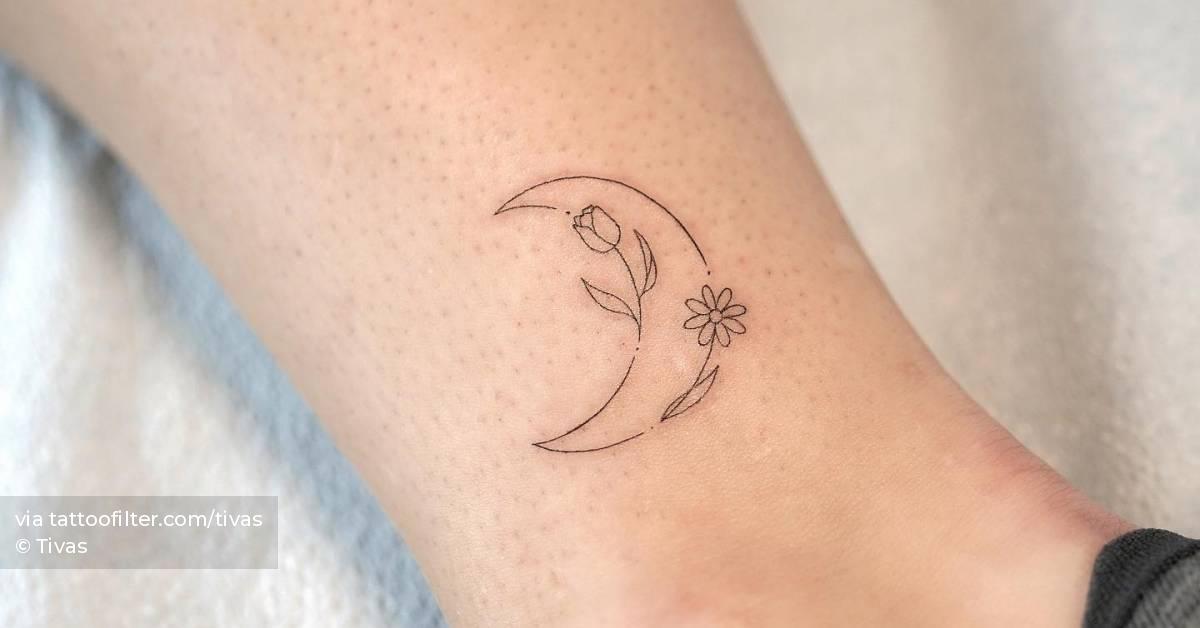 Fine line flower moon tattoo located on the ankle.
