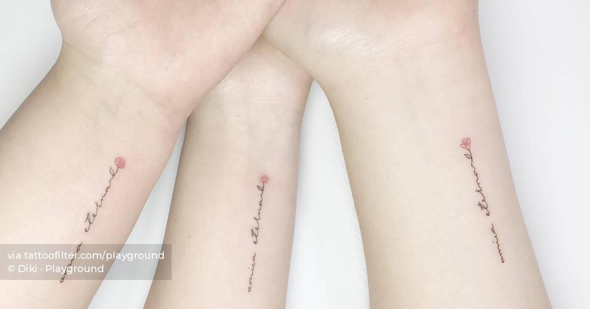 Matching lettering tattoo that says 