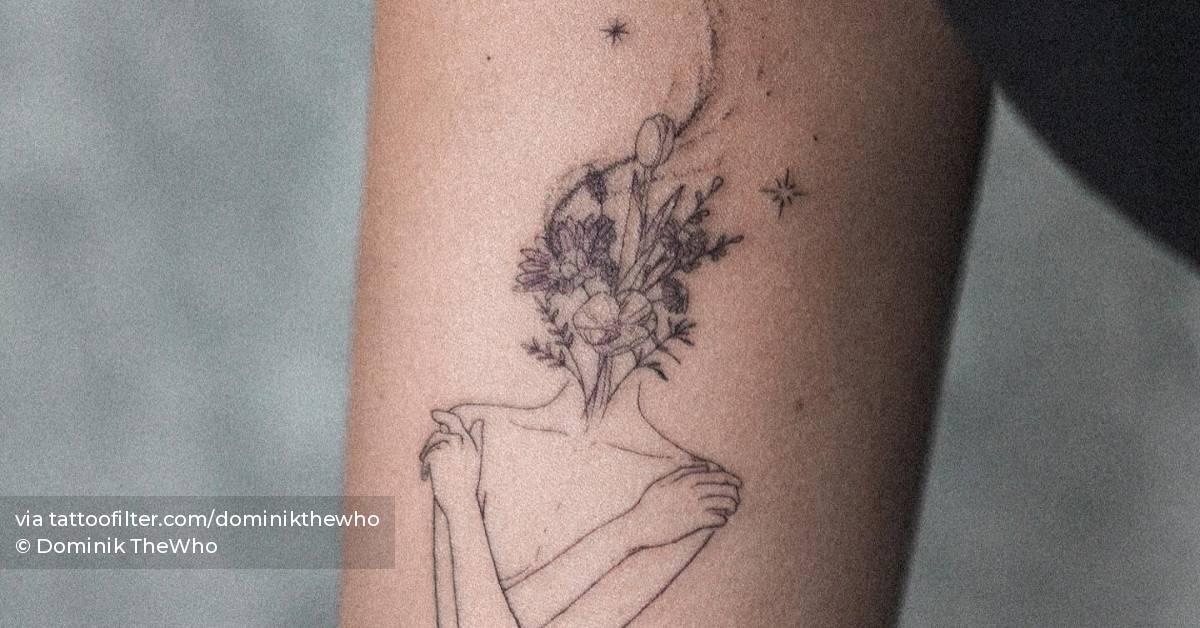 Fine line flower head woman tattoo located on the inner
