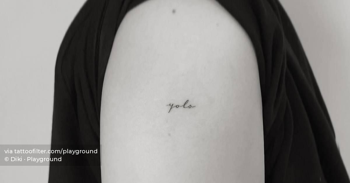  Yolo Lettering Tattoo Located On The Upper Arm 