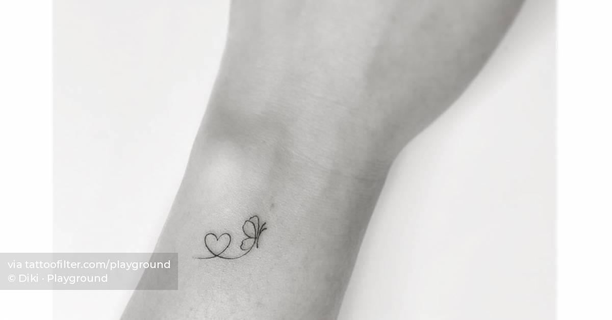 File line butterfly with heart tattoo done on the