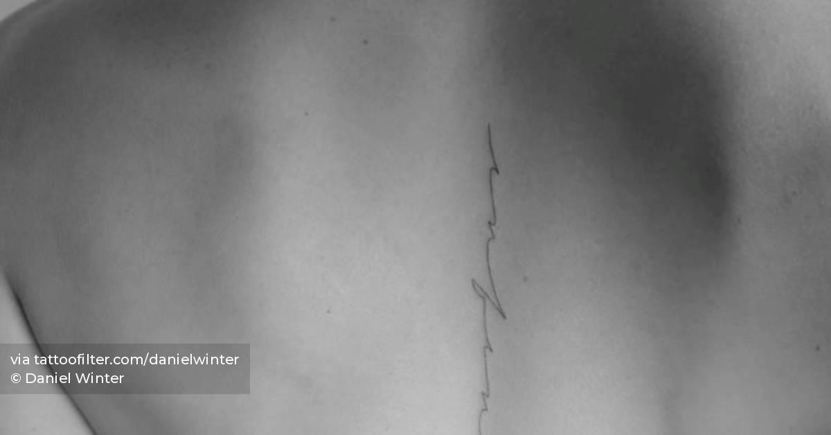 Tattoo Of The Word infinite Located On The Spine 
