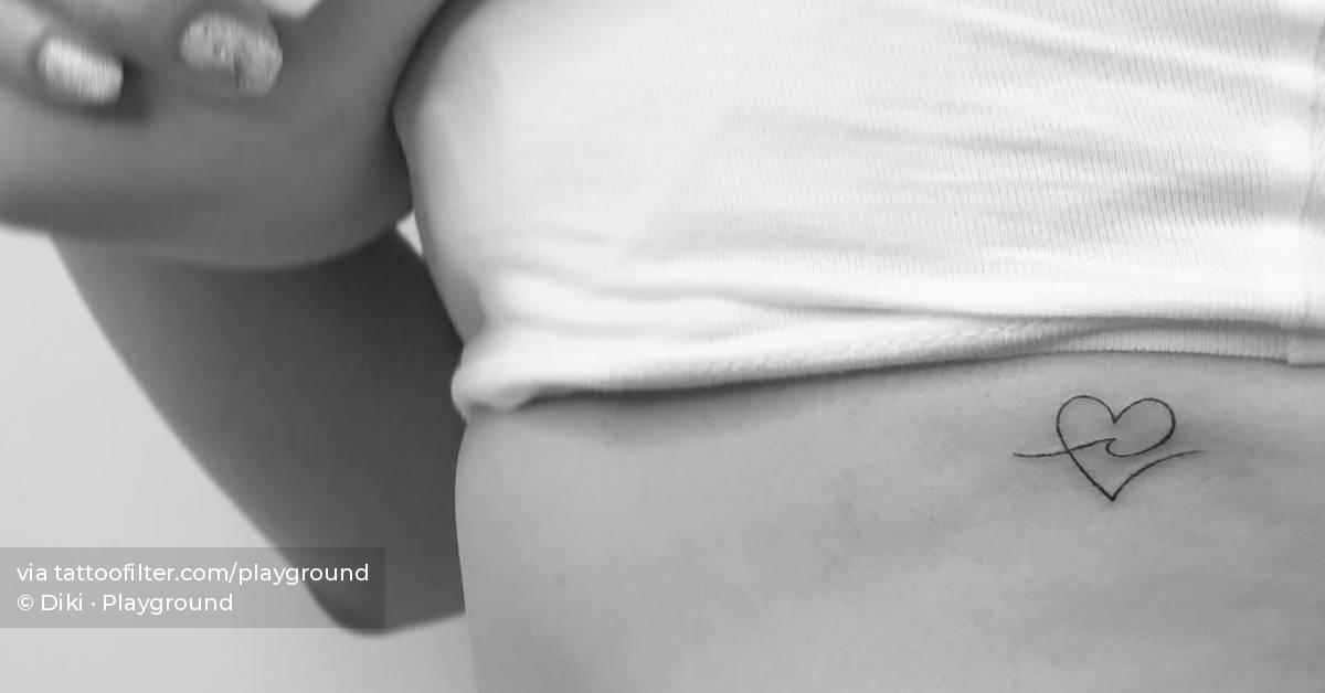 Minimalistic style heart and wave tattoo located on the