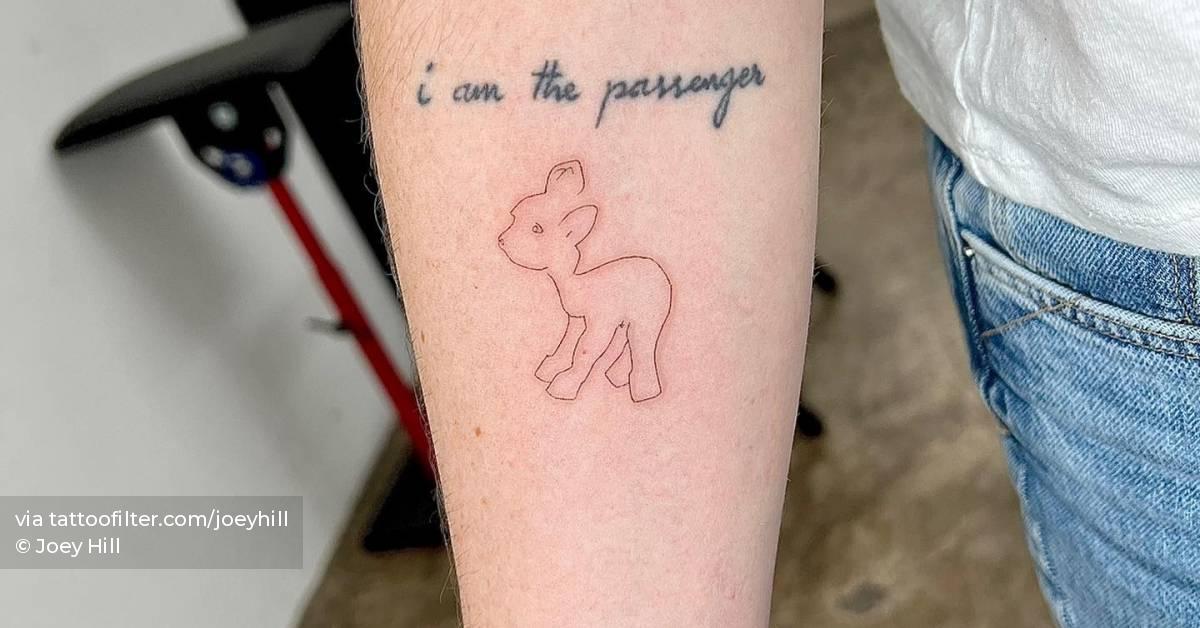 Single needle lamb tattooed on the inner forearm.