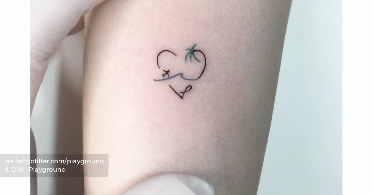 Minimalistic beach heart tattoo located on the wrist.