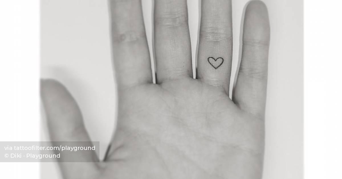 Tattoo of a tiny heart located on the finger.