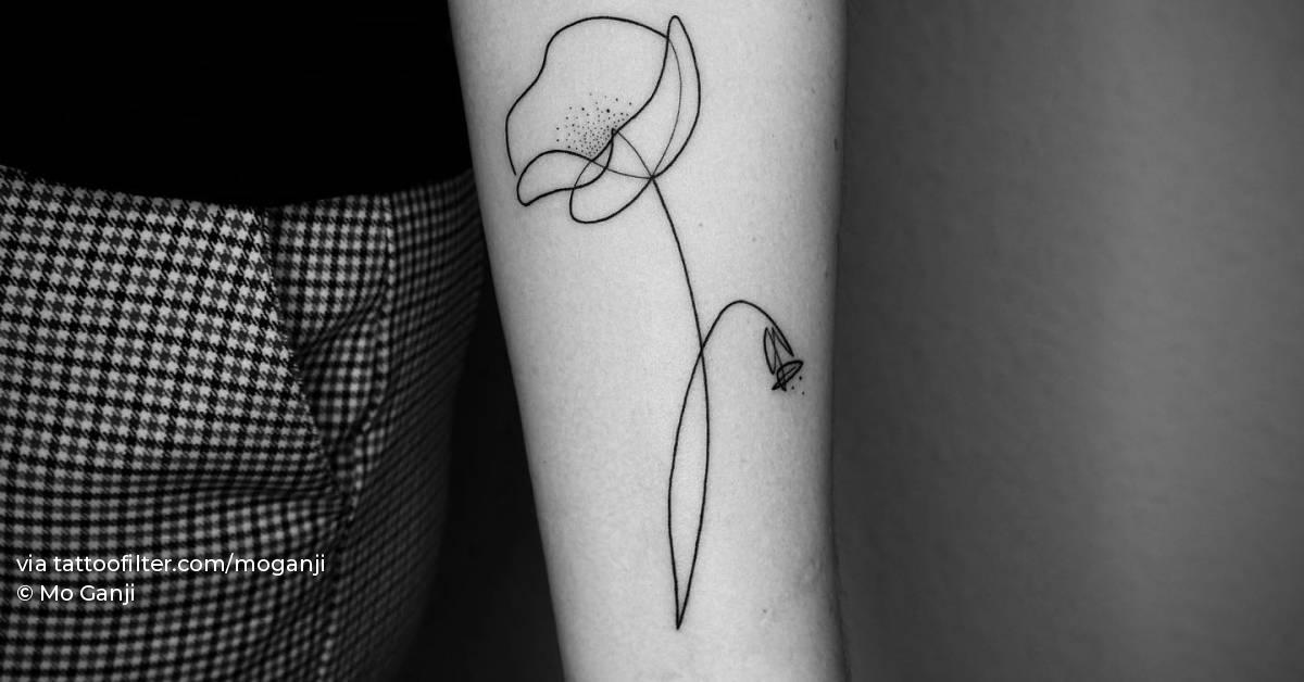 Abstract poppy tattoo located on the inner forearm.