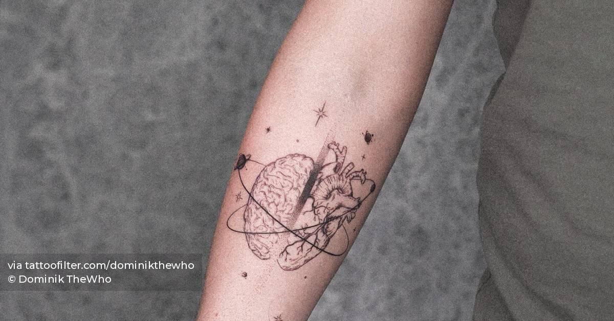 Heart vs. brain tattoo located on the inner forearm.