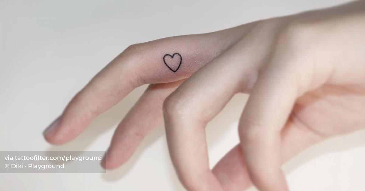 Tiny heart tattoo done on the finger.