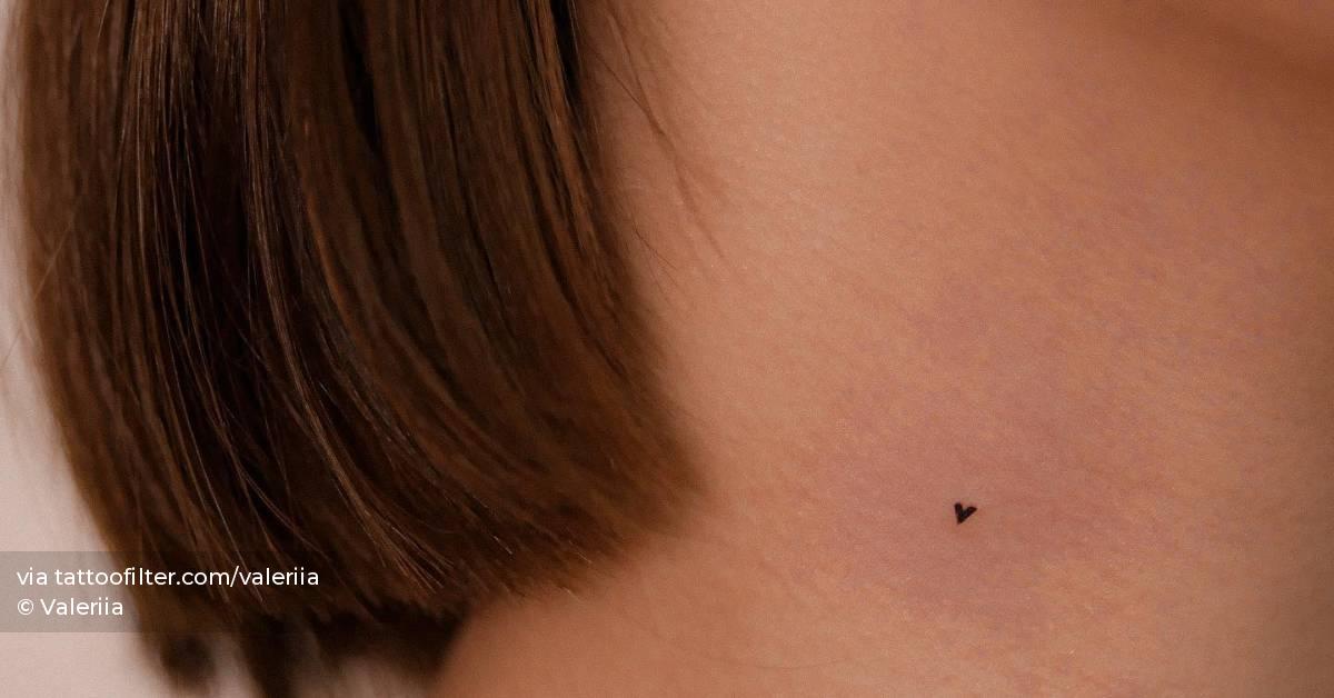 Micro heart tattoo done on the neck, minimalistic