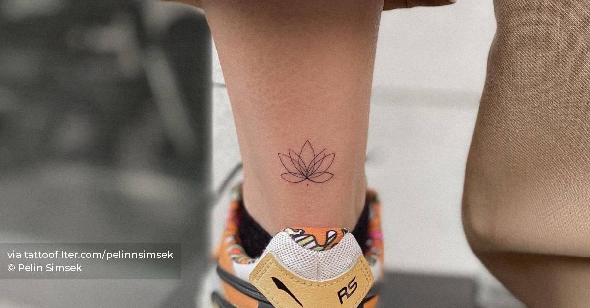 Fine line lotus flower tattoo done on the achilles.