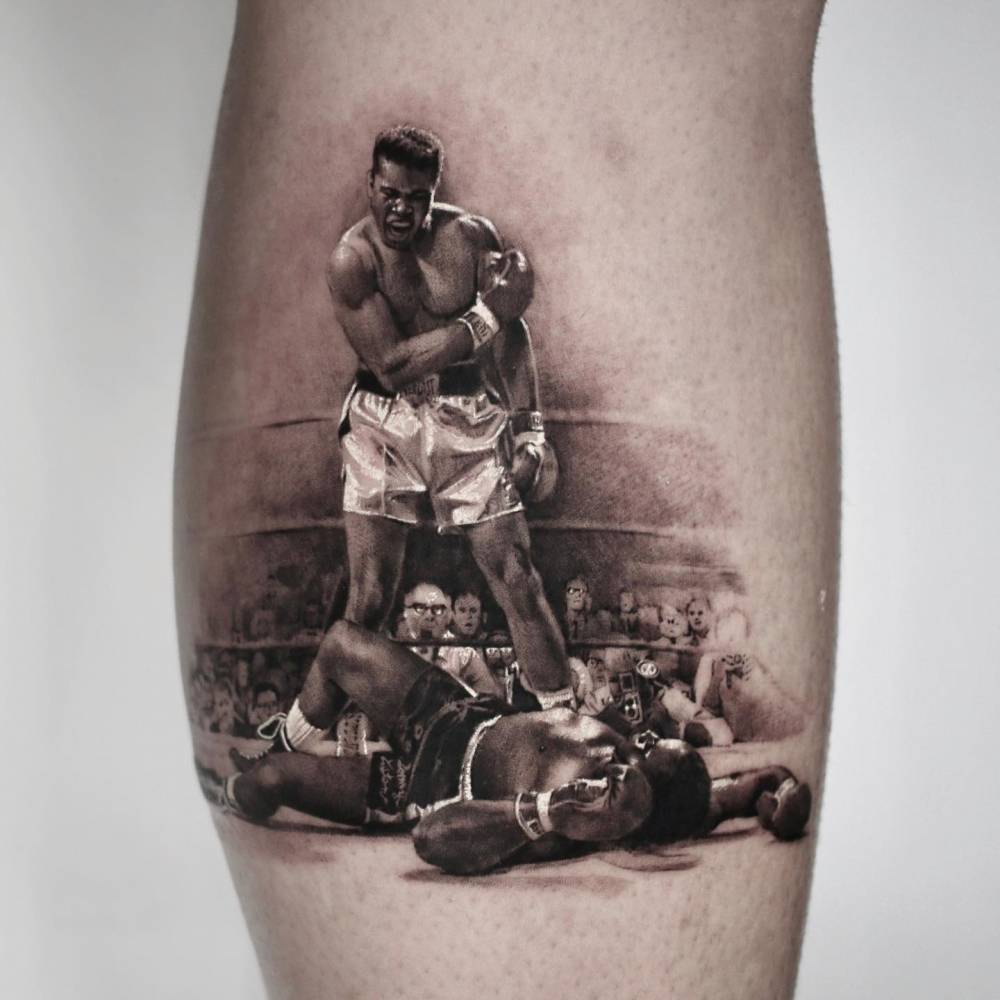 Muhammad Ali tattoo located on the calf, micro-realistic style.