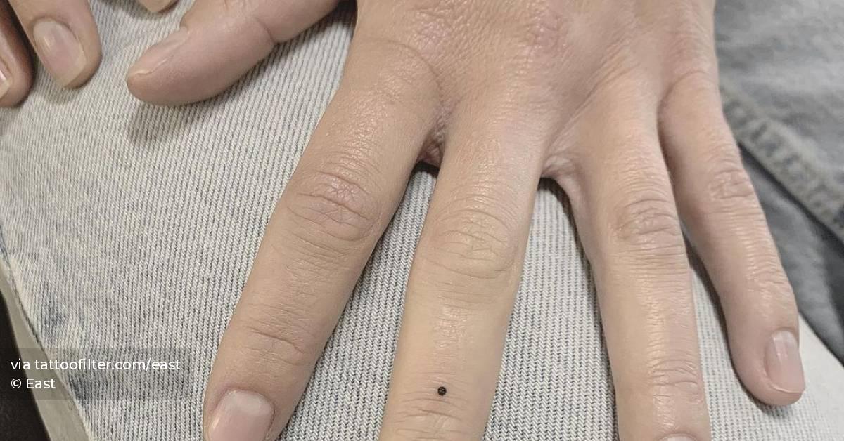 tiny-minimalistic-dot-tattoo-done-on-the-finger